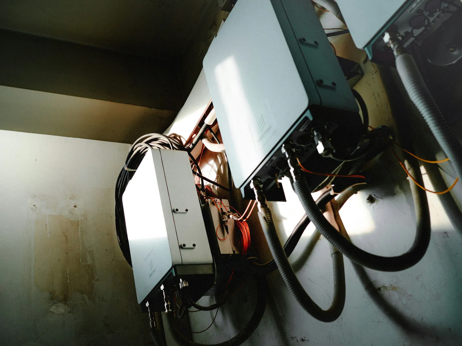 Wall-mounted inverter and battery control units with cabling in a utility room